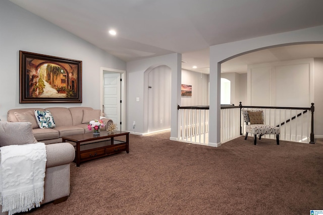 living room with vaulted ceiling and carpet floors