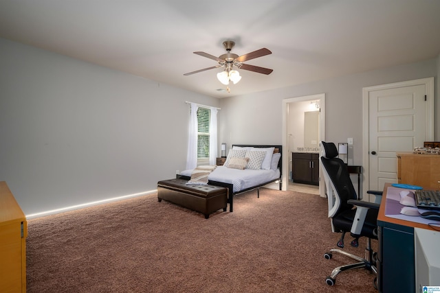 carpeted bedroom featuring ceiling fan and ensuite bath