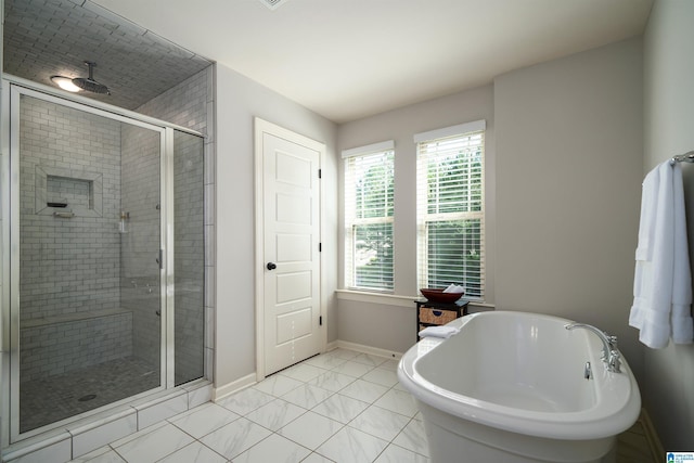 bathroom with plus walk in shower and tile patterned flooring