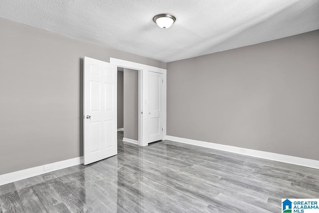 unfurnished bedroom with a textured ceiling