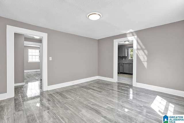 spare room featuring a textured ceiling