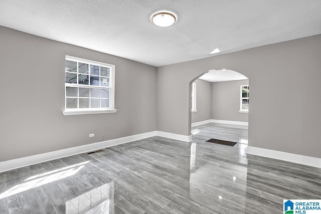 spare room featuring a textured ceiling