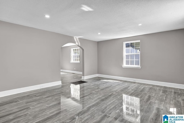 spare room featuring a textured ceiling