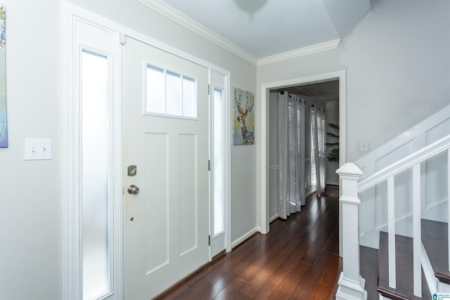 foyer entrance with crown molding and dark hardwood / wood-style floors