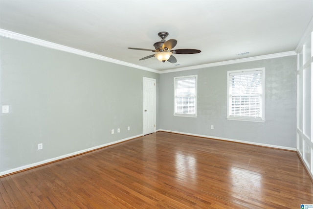 unfurnished room with hardwood / wood-style floors, ornamental molding, and ceiling fan