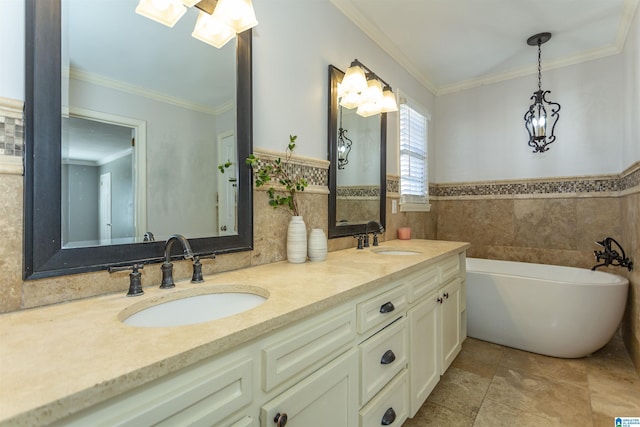 bathroom featuring crown molding, tile patterned floors, a tub to relax in, and vanity