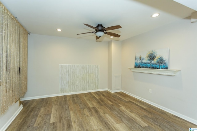 unfurnished room featuring ceiling fan and hardwood / wood-style floors