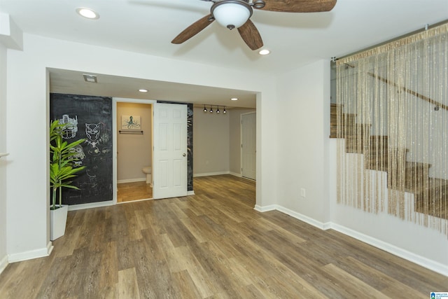 spare room featuring wood-type flooring