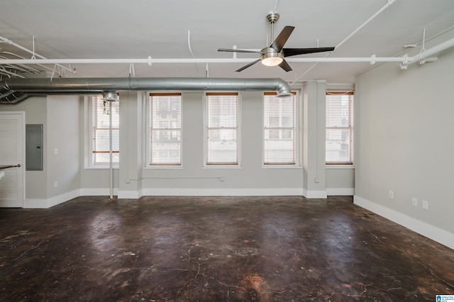 spare room featuring electric panel and ceiling fan