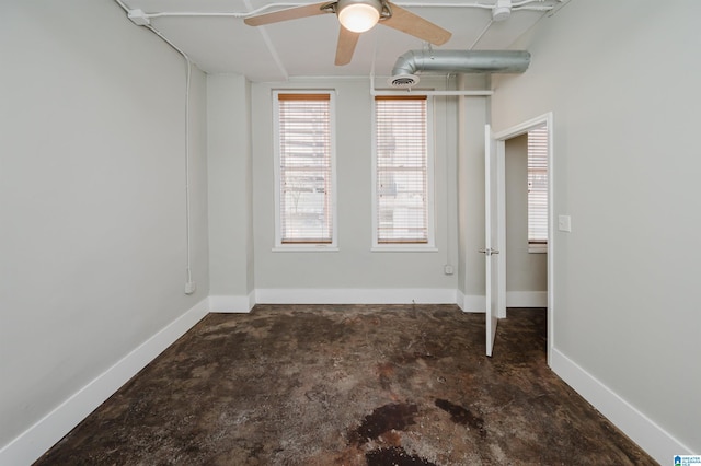 unfurnished room with ceiling fan