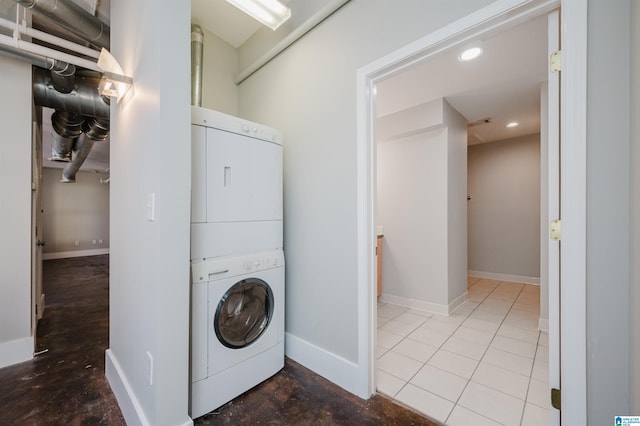 washroom featuring stacked washer / dryer