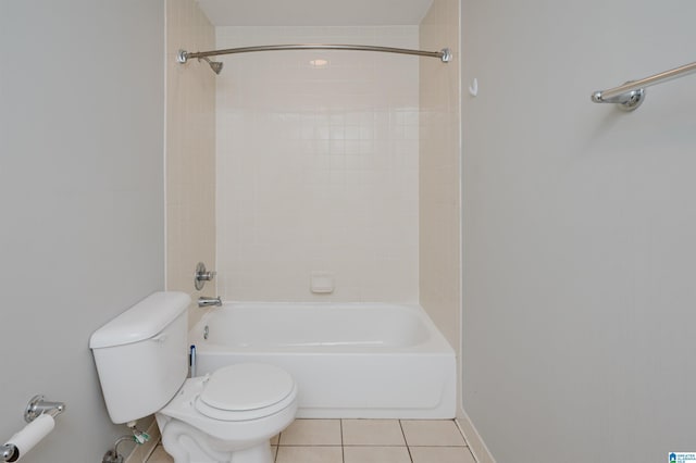 bathroom featuring toilet, tile patterned flooring, and bathing tub / shower combination