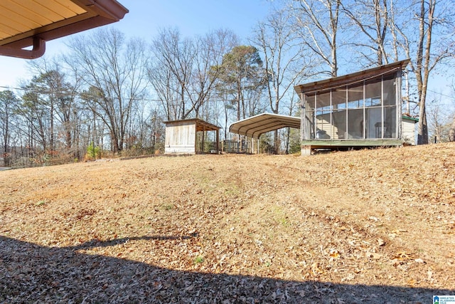 view of yard with a carport