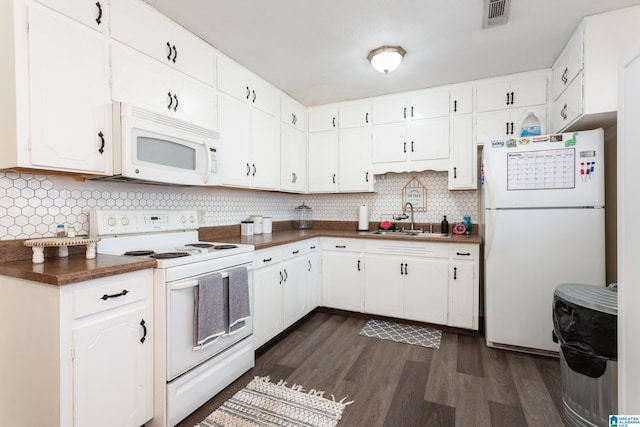 kitchen featuring white cabinets, white appliances, decorative backsplash, and sink