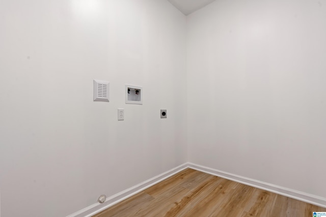 laundry area with washer hookup, hookup for an electric dryer, and wood-type flooring