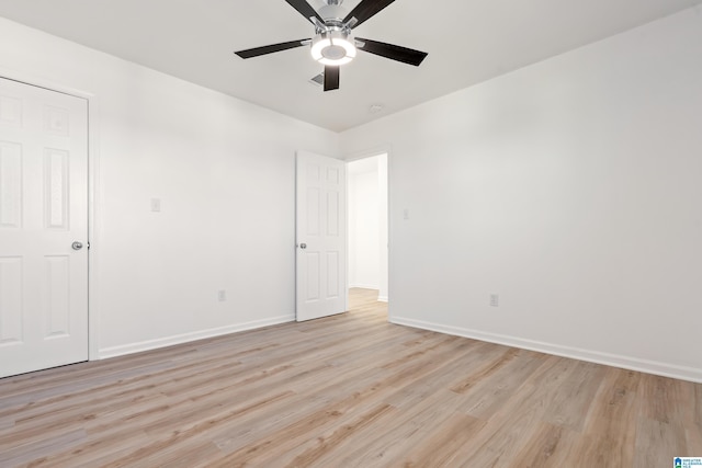 spare room with light hardwood / wood-style floors and ceiling fan