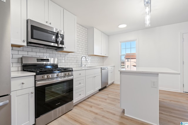 kitchen with white cabinetry, sink, and appliances with stainless steel finishes