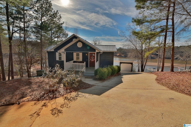 view of front of property with a garage and a porch