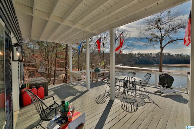 wooden deck with a water view