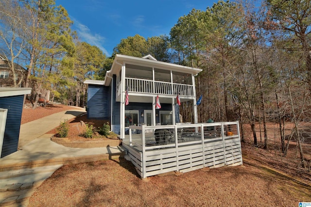 view of front of house featuring a sunroom