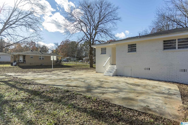 back of house with a patio area