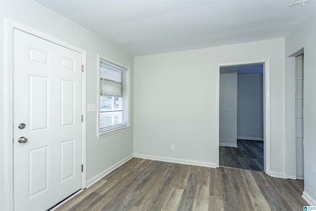 spare room featuring dark hardwood / wood-style floors