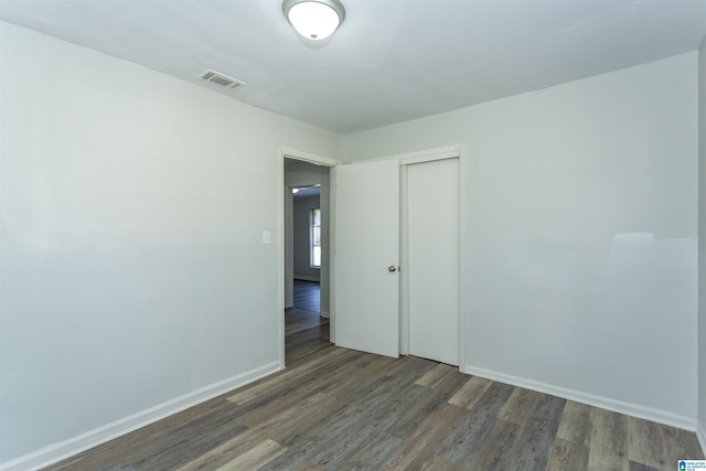 empty room featuring dark hardwood / wood-style floors