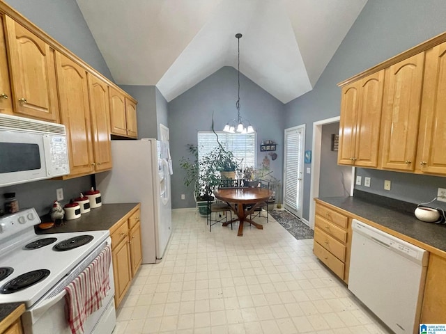 kitchen with hanging light fixtures, white appliances, vaulted ceiling, and a notable chandelier