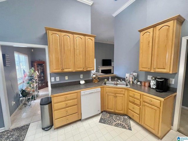 kitchen featuring dishwasher, sink, light brown cabinets, and ornamental molding