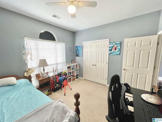 carpeted bedroom with a closet and ceiling fan