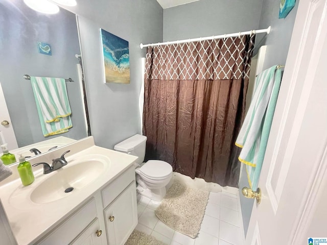 bathroom with tile patterned flooring, vanity, walk in shower, and toilet