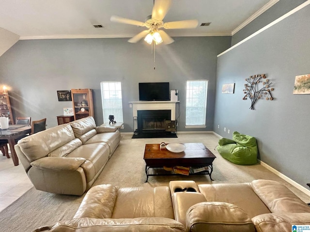 carpeted living room with crown molding, high vaulted ceiling, and ceiling fan