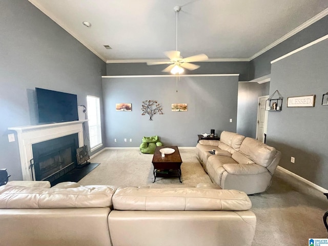 carpeted living room featuring crown molding and ceiling fan