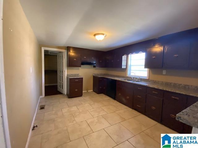 kitchen with sink and dark brown cabinets