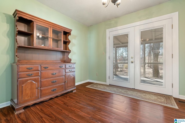 entryway featuring french doors and dark wood-type flooring