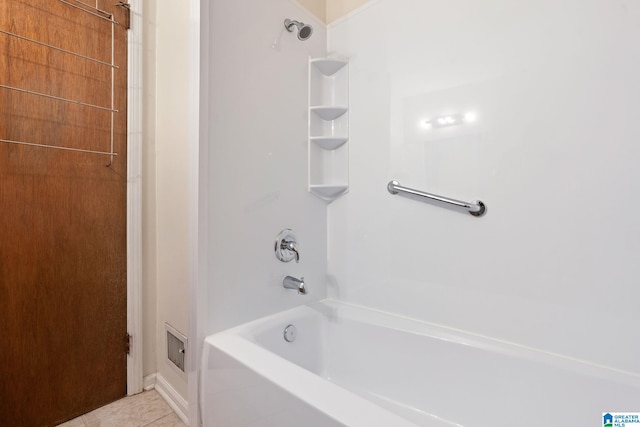 bathroom with bathing tub / shower combination and tile patterned flooring