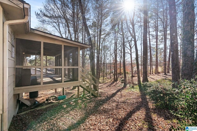 view of yard featuring a sunroom