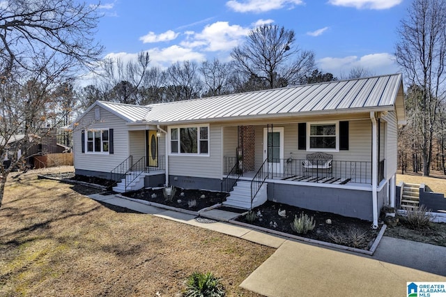 single story home featuring covered porch