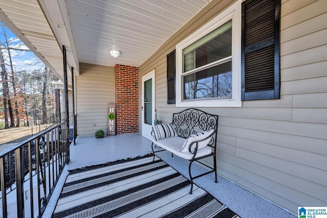 wooden terrace with a porch