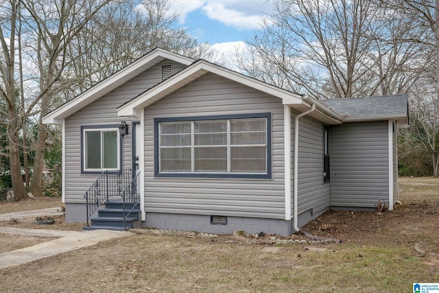 bungalow-style home with a front lawn