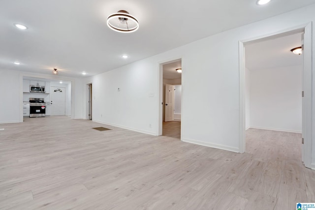 unfurnished living room with light hardwood / wood-style floors