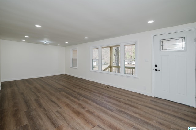 foyer entrance featuring dark hardwood / wood-style floors