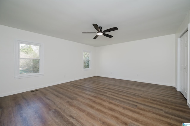 interior space featuring ceiling fan and dark hardwood / wood-style floors