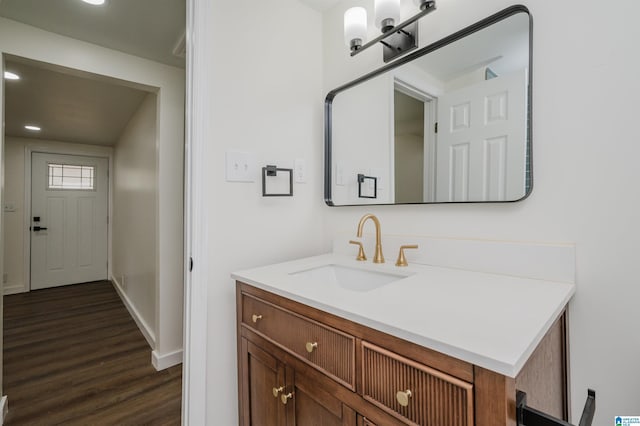 bathroom featuring hardwood / wood-style flooring and vanity