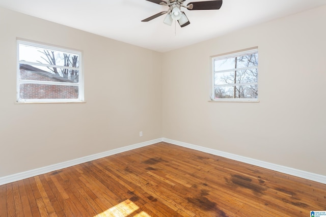 unfurnished room with hardwood / wood-style floors and ceiling fan