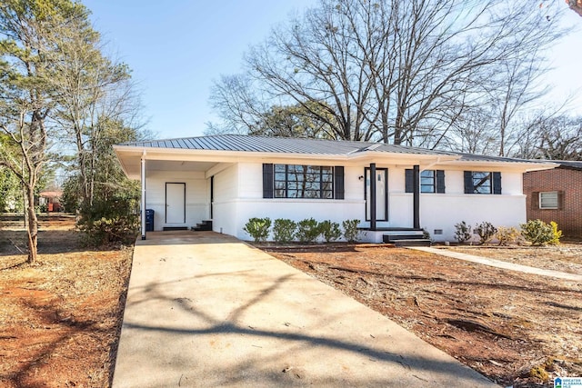 ranch-style home featuring a carport