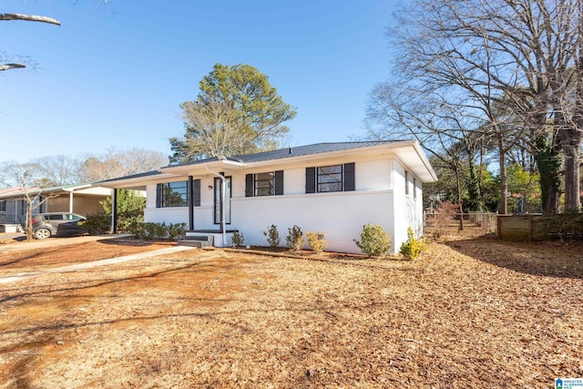 ranch-style home with a carport