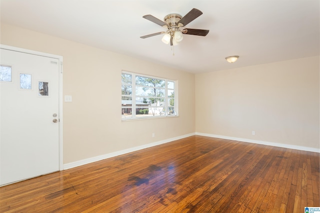 interior space featuring ceiling fan and dark hardwood / wood-style flooring