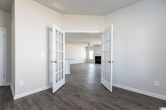 hall with french doors and dark hardwood / wood-style flooring