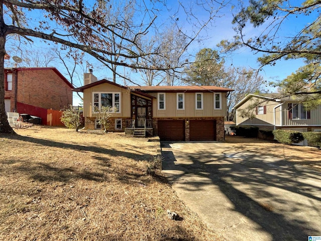 bi-level home featuring a garage